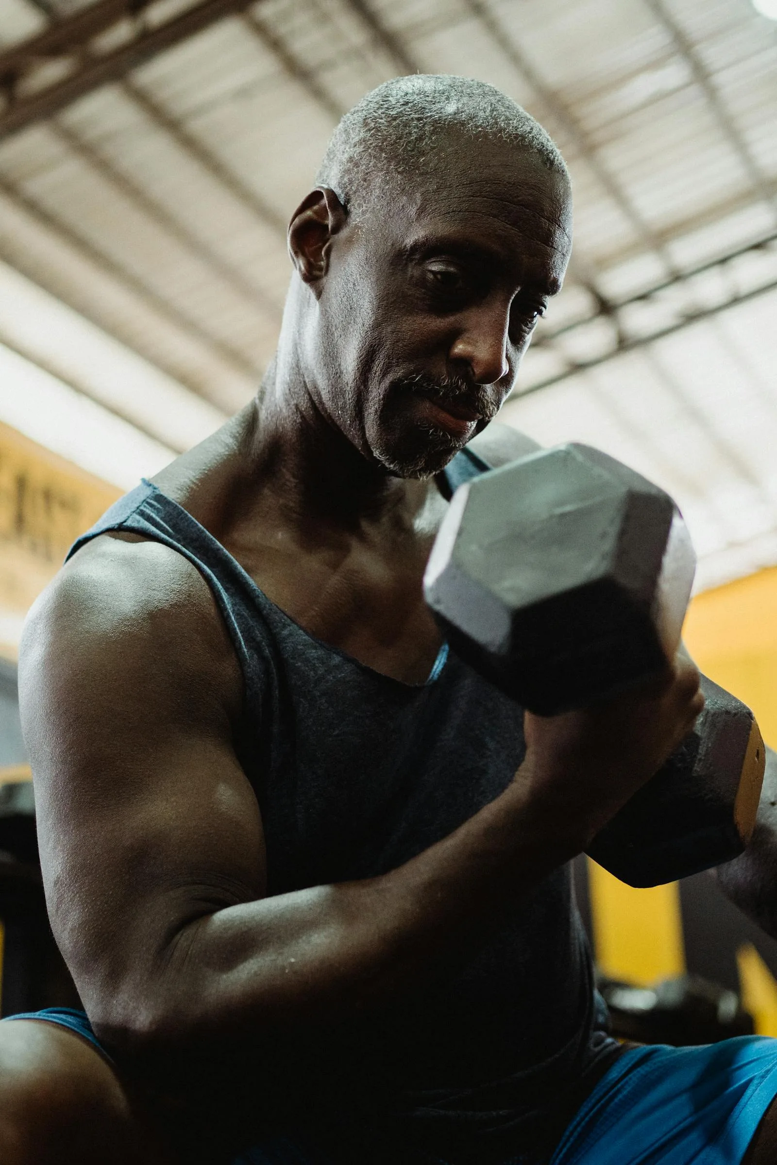 Controlled dumbbell training used to show strength without chasing size.