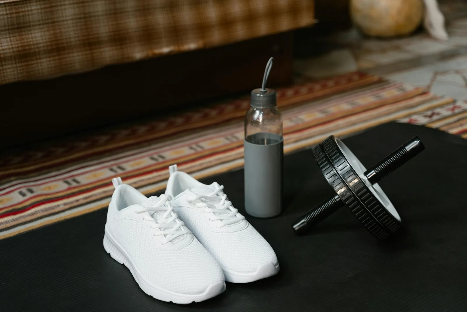 Workout essentials including shoes and water bottle.