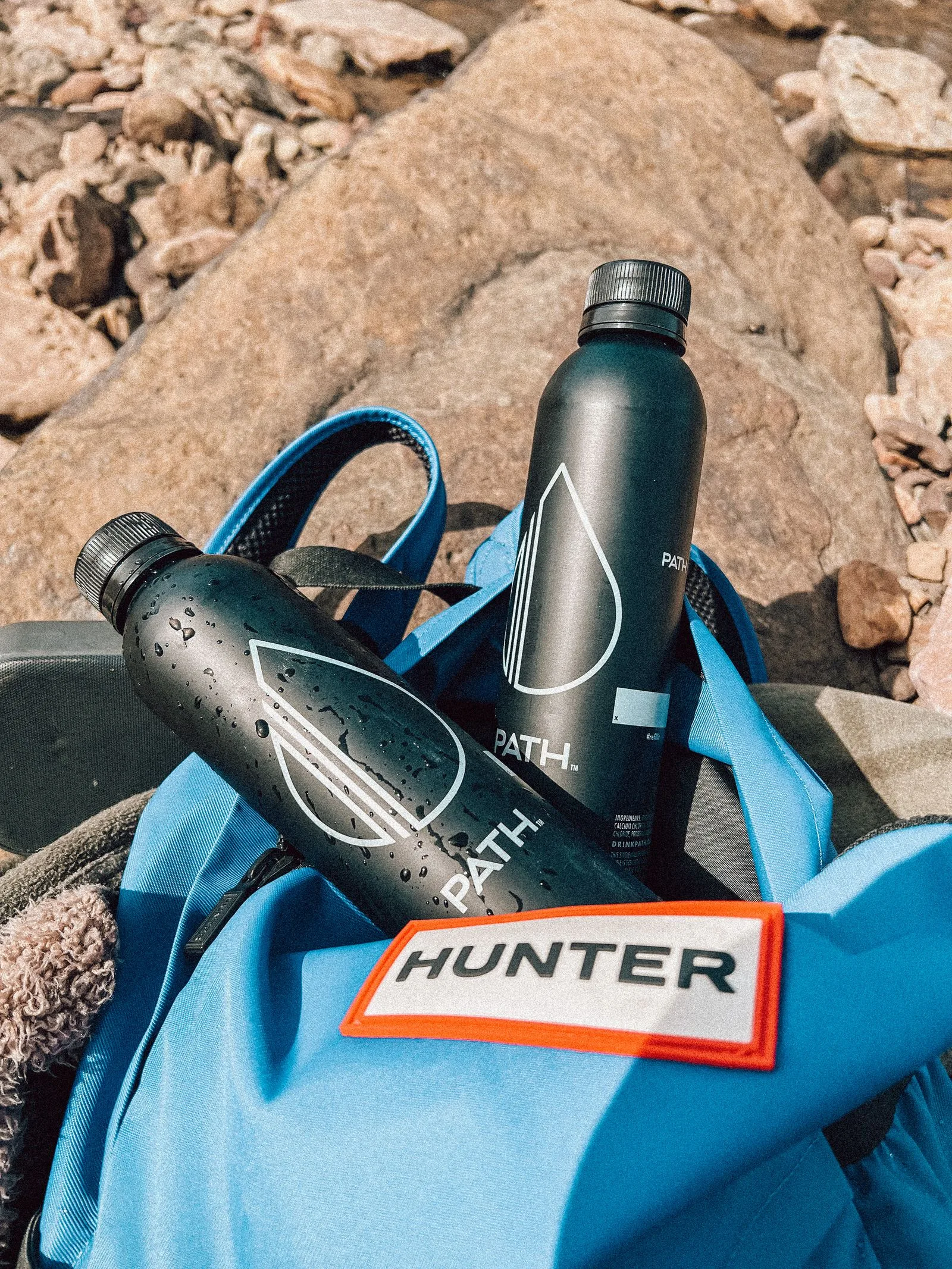 Water bottles packed in a bag, used for short-term gym visit preparation.