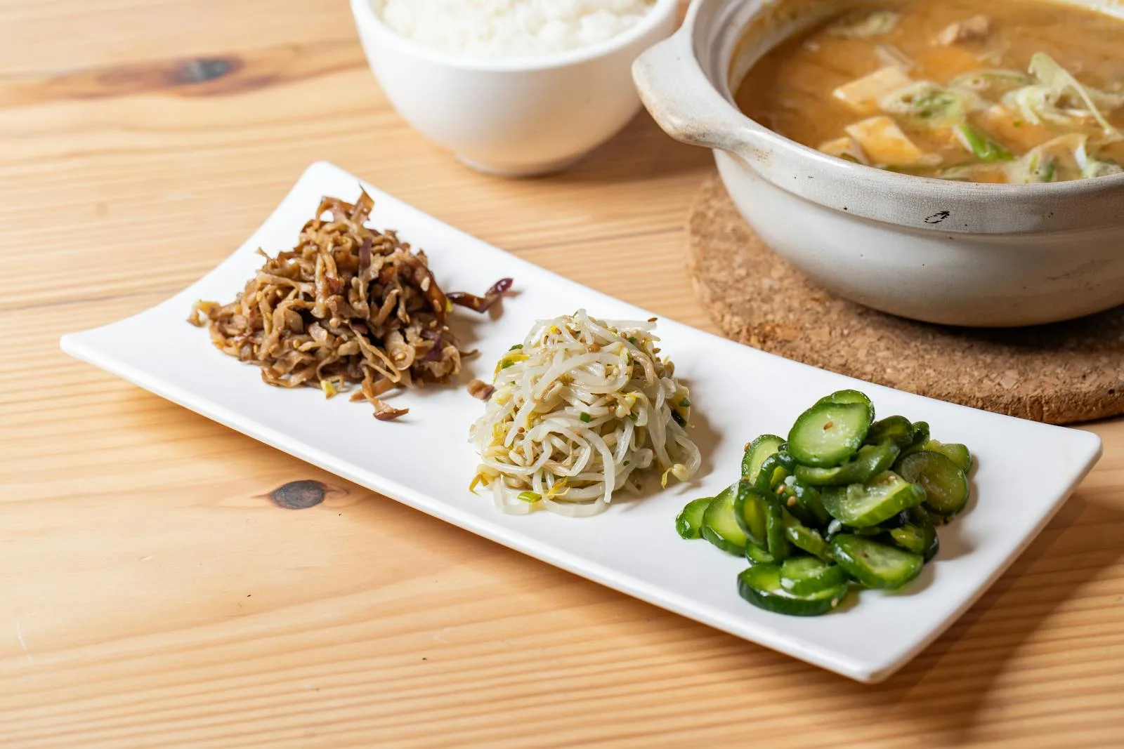 Korean meal with soup, rice, and side dishes used for protein planning context.