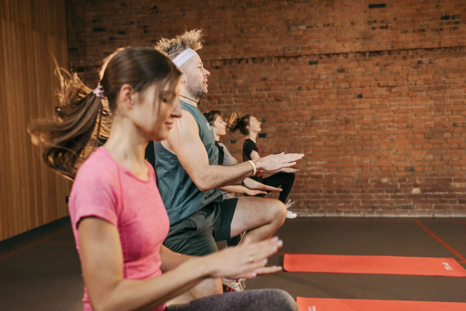 Group workout session in an indoor studio.